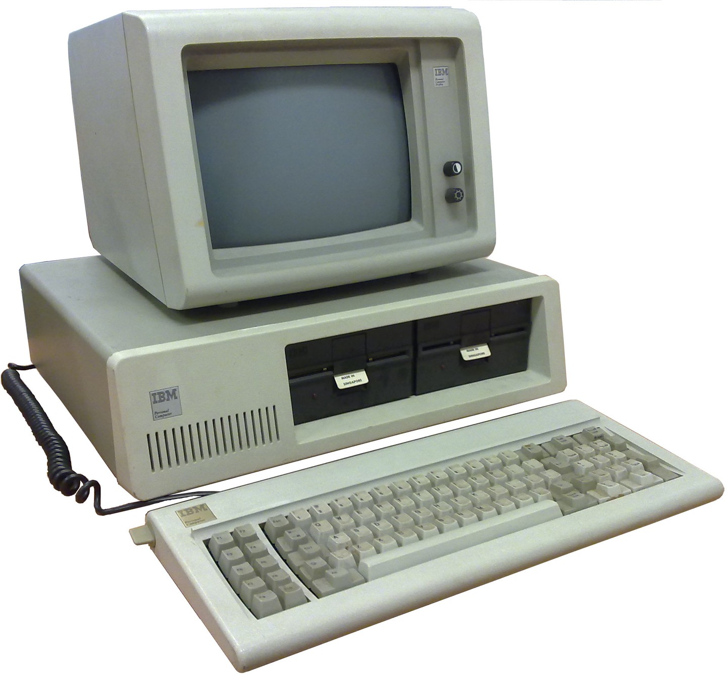 An IBM PC 5150 with its monitor and keyboard.